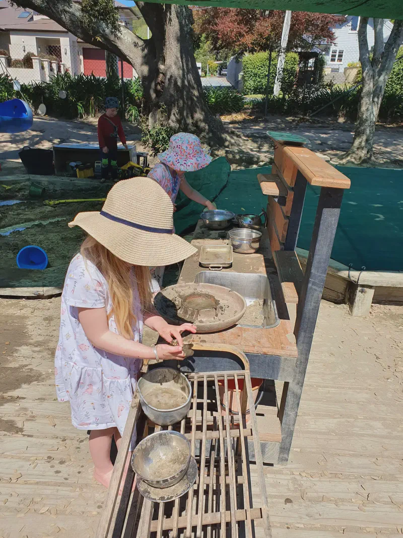 Children playing at the mud kitchen